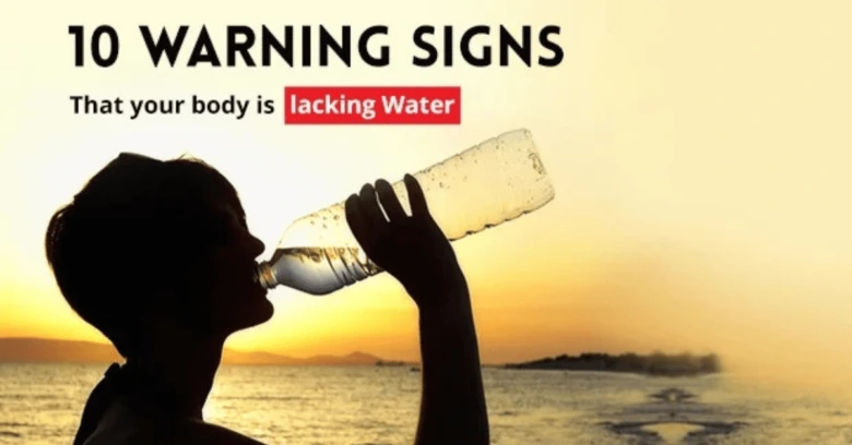Person drinking water from bottle