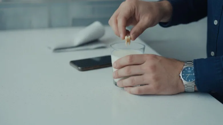 Broken tooth in milk glass