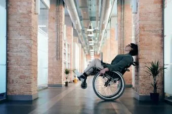Person in wheelchair resting
