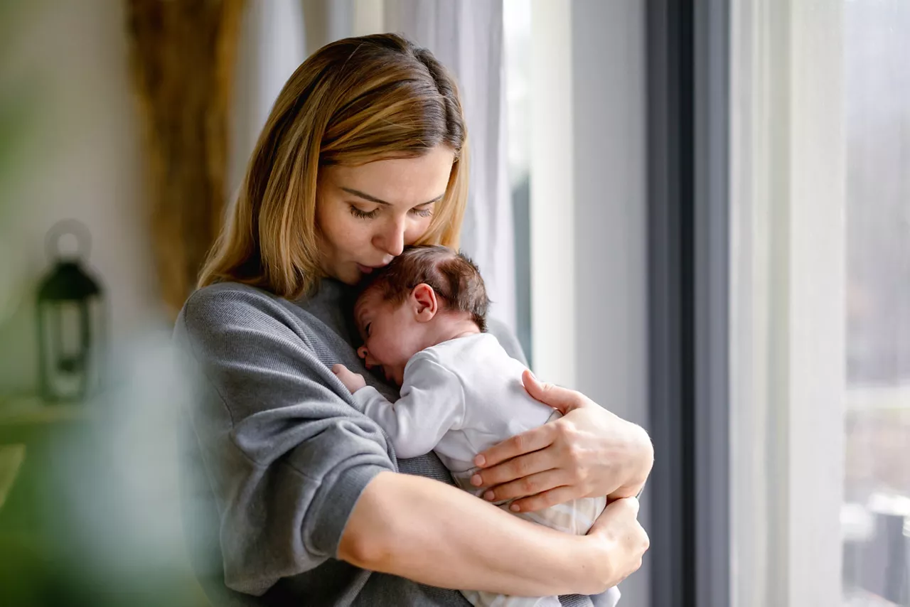 Mother holding newborn baby