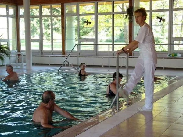 Therapeutic pool session with therapist
